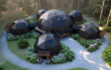 A imagem mostra um conjunto de cúpulas geodésicas, apresentando um projeto arquitetônico moderno e ecológico, cercado por uma vegetação exuberante e um ambiente natural sereno.
