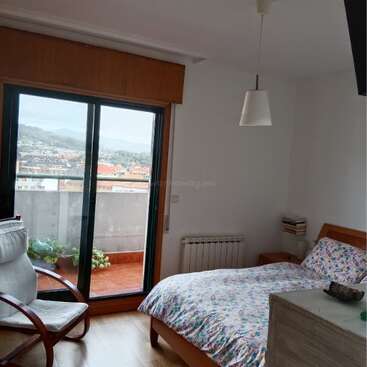 This collage showcases a modern apartment with scenic views, cozy bedrooms, bright living room, well-equipped kitchen, two bathrooms, balcony, large terrace, and appealing decor.