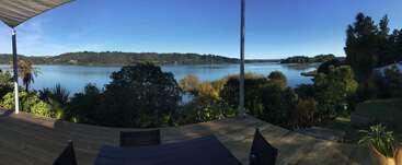 The image depicts a serene outdoor scene, featuring a tranquil body of water, lush greenery, and a picturesque landscape, evoking a sense of calm and serenity. The atmosphere is peaceful and idyllic.