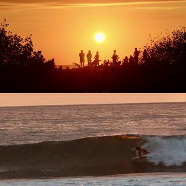 The image shows a vibrant sunset with people silhouetted on the beach above, and a surfer riding a wave in the ocean below, both scenes peaceful.