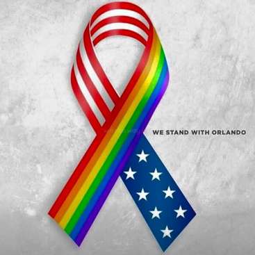 The image features a rainbow ribbon intertwined with an American flag, accompanied by the text \"WE STAND WITH ORLANDO\" on a gray background.