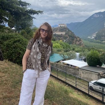 The image depicts a serene scene with a body of water, trees, and a clear sky, evoking a sense of calmness and tranquility. The overall atmosphere is peaceful and idyllic.