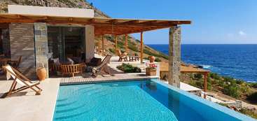 The image depicts a serene outdoor setting, featuring a pool and a house with a large yard, surrounded by trees and bushes, evoking a sense of tranquility and relaxation.