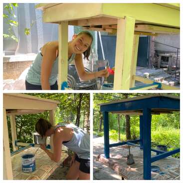 A young woman is painting a wooden table outdoors. The process starts with light colors and ends with the table beautifully finished in vibrant blue.