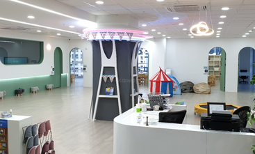 The image depicts a well-organized office space with a desk, chair, and computer, featuring a neutral color scheme and a clean, minimalist aesthetic. The overall atmosphere is one of productivity and efficiency.