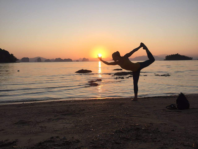 Sunset-Island-Yoga-retreat-yoga-silhouette woman yoga pose on beach in thailand