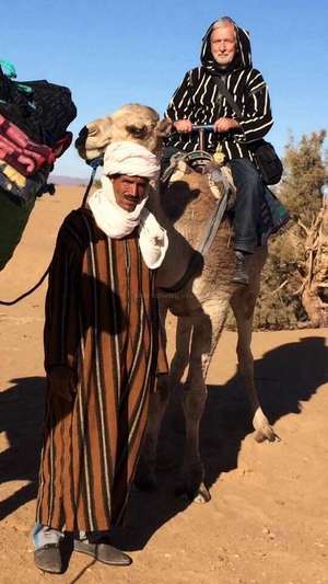 workawayer riding a camel