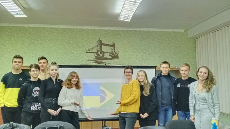 Workawayer teaching English to a group of students in a classroom in Ukraine