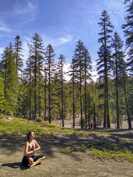 workawayer doing yoga relax in forest nature