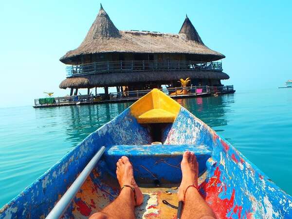 shot of feet relaxing on a canoe tropical paradise trip