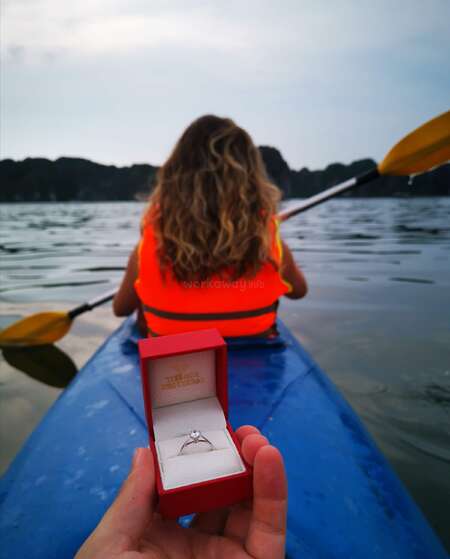 traveller showing engagement ring to back of traveller kayaking