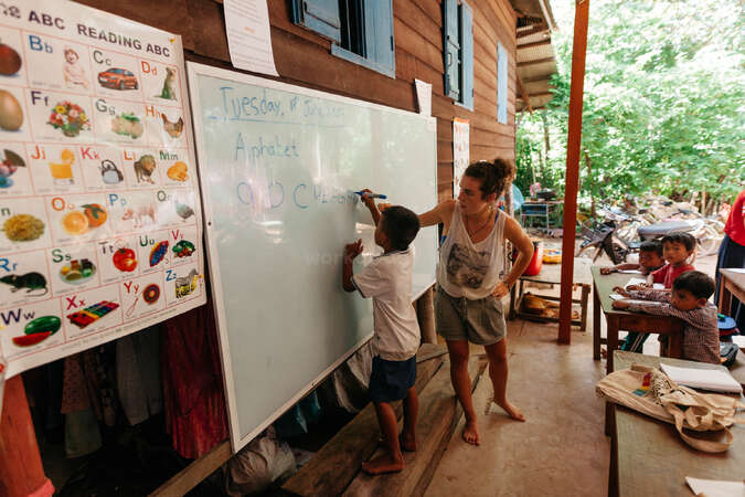 solo woman workawayer teaching children english in school