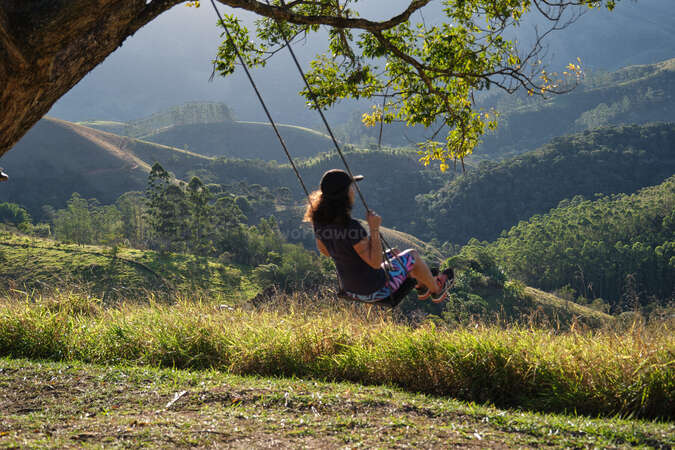 outdoor-nature-wellbeing-top-places-workaway solo workaway traveller on a swing facing mountains of sao paolo
